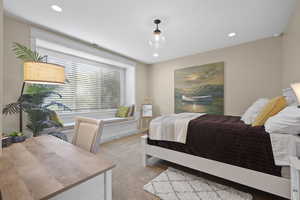 Bedroom featuring light carpet and recessed lighting