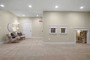 Sitting room with carpet flooring, recessed lighting, and baseboards
