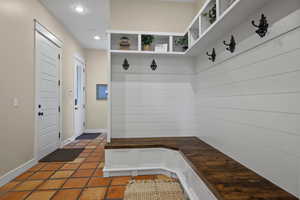 Mudroom featuring recessed lighting, baseboards, and light tile patterned floors