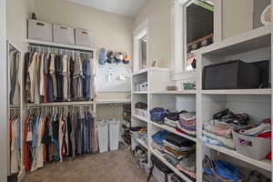 Spacious closet featuring carpet floors