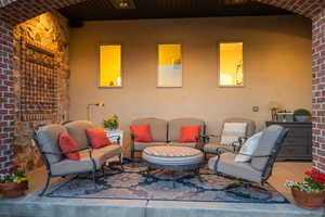 View of patio with an outdoor hangout area