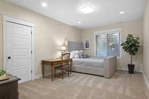 Bedroom featuring light carpet, baseboards, and recessed lighting