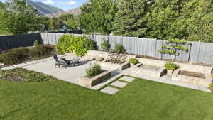 View of yard with a mountain view and a patio