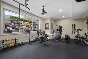 Workout area featuring baseboards and recessed lighting