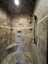Full bathroom with a tile shower