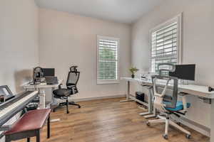 Home office with wood finished floors