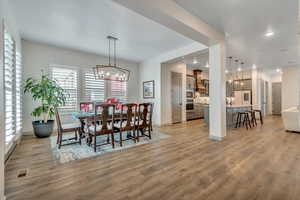 Dining room featuring a chandelier, light wood-type flooring, and recessed lighting and open concept main living area