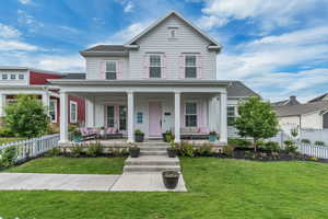 View of front of house featuring outdoor lounge area and a large front porch