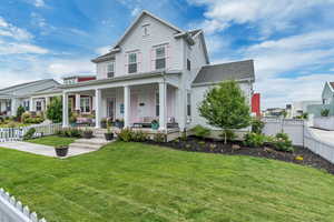 View of front of property with a fenced backyard and fenced front yard