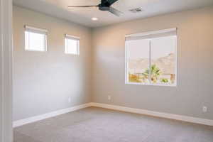 Unfurnished room with a ceiling fan, baseboards, light colored carpet, and recessed lighting