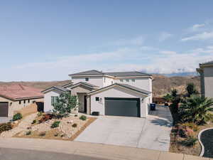 Traditional home with stucco siding and driveway