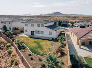 Aerial view of residential area featuring a mountainous background