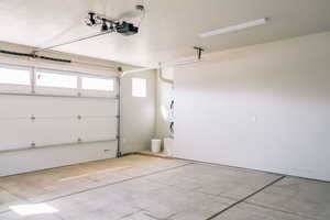 Garage featuring a garage door opener