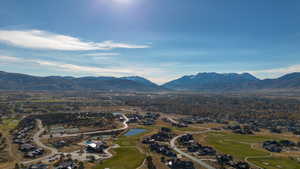 Aerial view of a local golf course and a water and mountain view