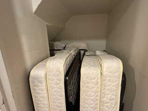 Bedroom featuring lofted ceiling