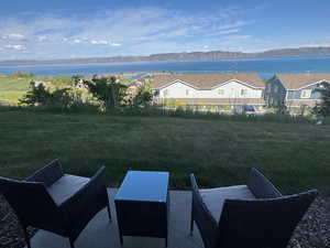 View of yard with a water and mountain view