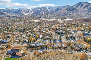 View of mountain backdrop featuring nearby suburban area