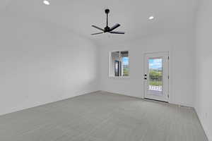 Carpeted empty room with a ceiling fan, recessed lighting, and baseboards