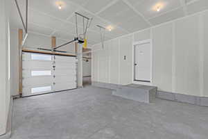Garage featuring a garage door opener