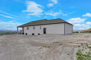Back of property featuring a mountain view