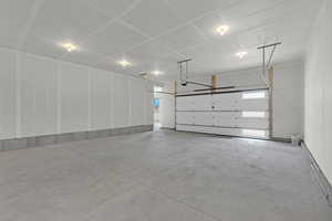 Garage featuring a garage door opener