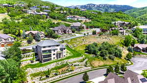 Aerial perspective of suburban area with a mountain backdrop