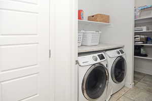 Laundry area featuring washer and clothes dryer