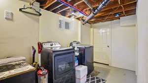 Washroom featuring independent washer and dryer