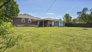 View of yard featuring a fire pit and central AC unit