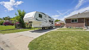 View of car parking featuring concrete driveway