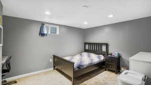 Bedroom with carpet flooring, recessed lighting, and baseboards
