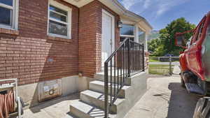 Property entrance with brick siding