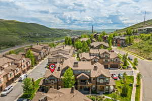 Aerial perspective of suburban area with a mountain backdrop