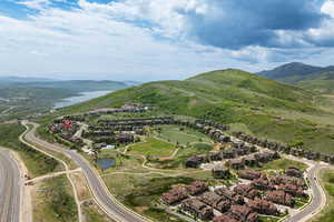 View of property location with nearby suburban area and a water and mountain view