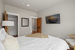 Bedroom with recessed lighting, a closet, and baseboards