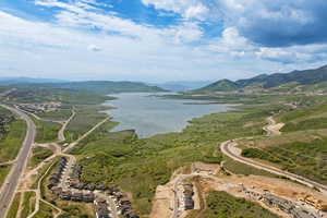 View of property location featuring a water and mountain view