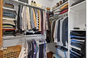 Spacious closet with wood finished floors