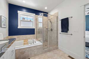 Ensuite bathroom with a garden tub, tile patterned flooring, a stall shower, vanity, and recessed lighting