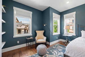 Bedroom with baseboards and wood finished floors