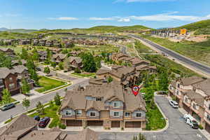 Aerial perspective of suburban area featuring a mountain backdrop