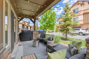 View of patio / terrace featuring area for grilling, an outdoor living space, and a residential view