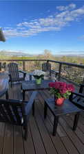Wooden deck featuring a mountain view