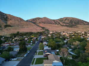 View of mountain backdrop featuring nearby suburban area