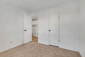 Unfurnished bedroom with carpet
