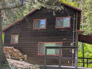 View of property exterior featuring a deck