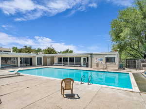 Community pool with a patio area
