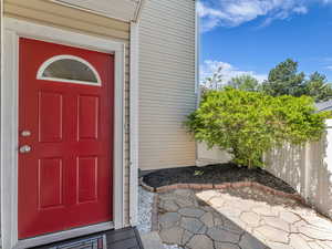 Entrance to property with a patio area