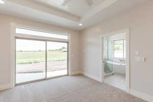 Empty room with carpet floors, a ceiling fan, recessed lighting, and baseboards