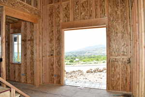 Front Doorway to outside with a mountain view