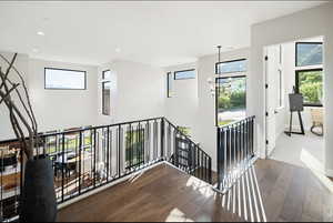 Stairs with wood-type flooring, recessed lighting, and baseboards